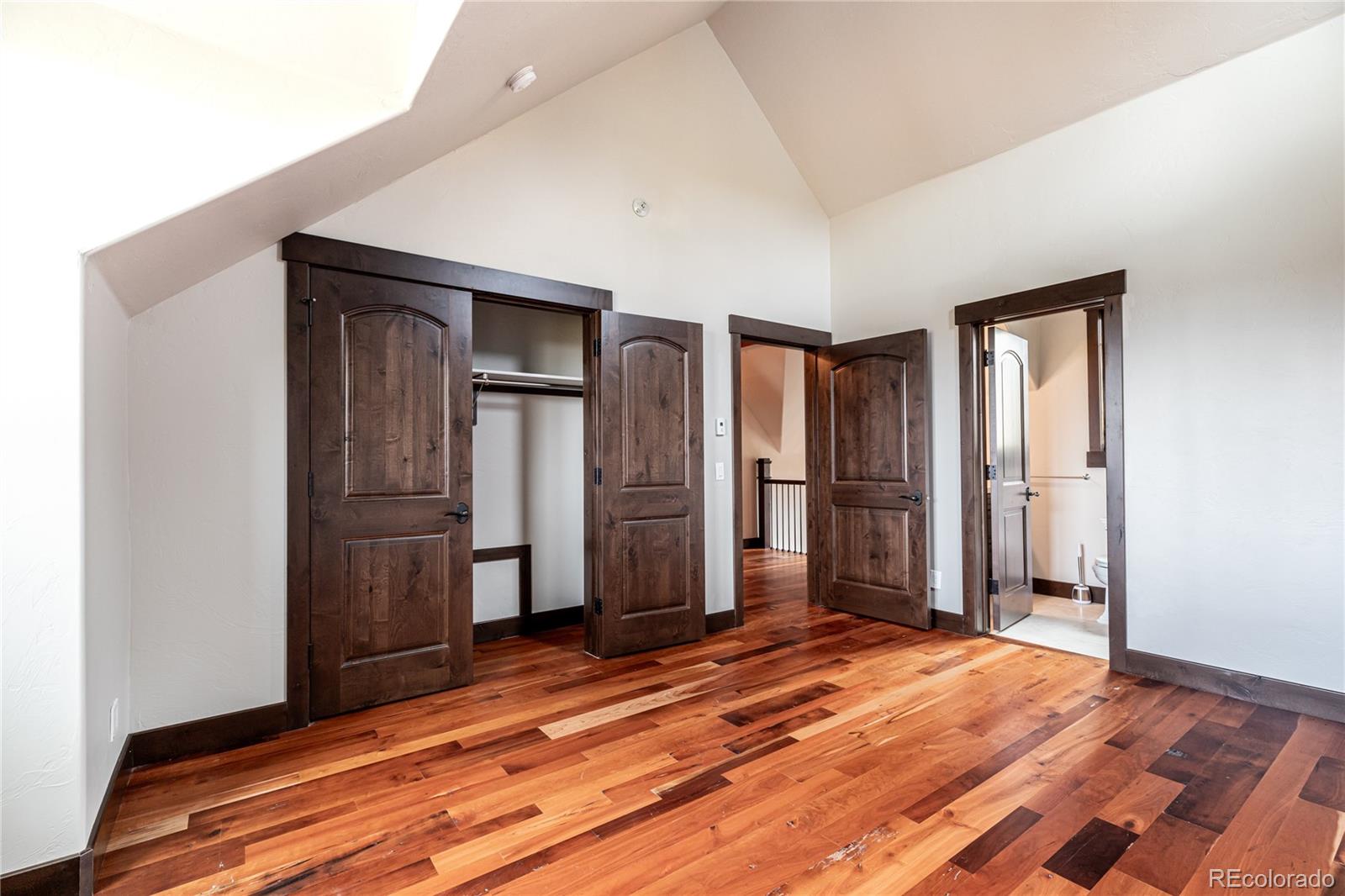 26050 Henderson Park Road Oak Creek, CO 80467 - Photo 24 of 40 a view of a livingroom with wooden floor and closet