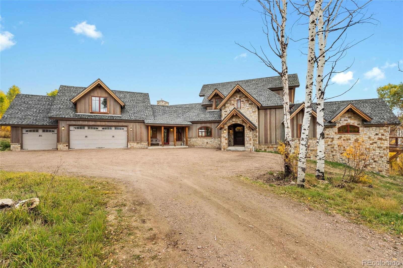 26050 Henderson Park Road Oak Creek, CO 80467 - Photo 38 of 40 a front view of a house with a yard
