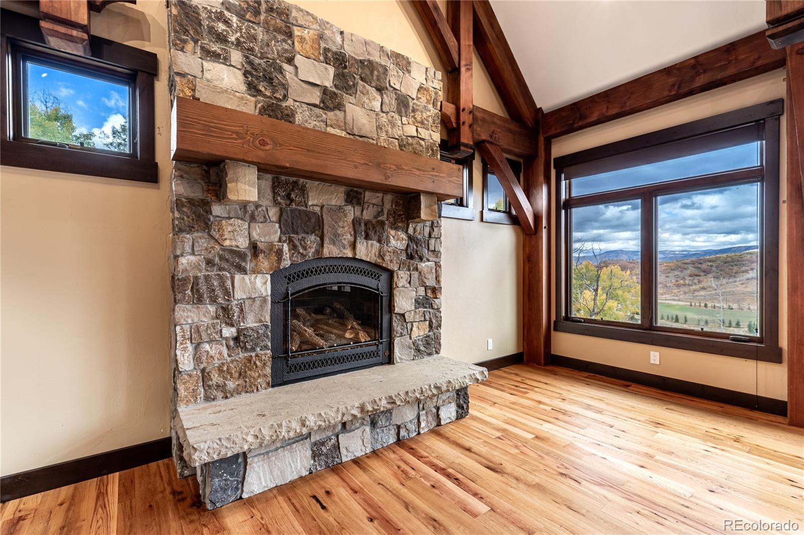 26050 Henderson Park Road Oak Creek, CO 80467 - Photo 5 of 40 a view of an empty room with wooden floor and a window