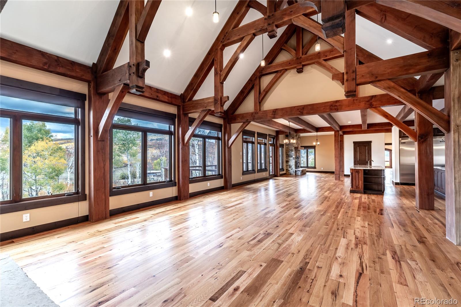 26050 Henderson Park Road Oak Creek, CO 80467 - Photo 6 of 40 a view of an empty room with wooden floor and windows