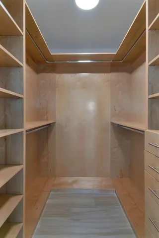 a view of an empty walk in closet