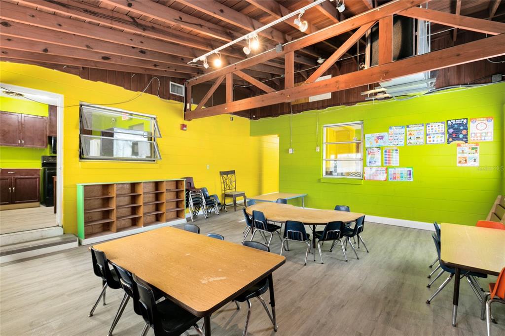 4607 North Pine Hills Road Orlando, FL 32808 - Photo 17 of 26 a view of a patio with a table and chairs