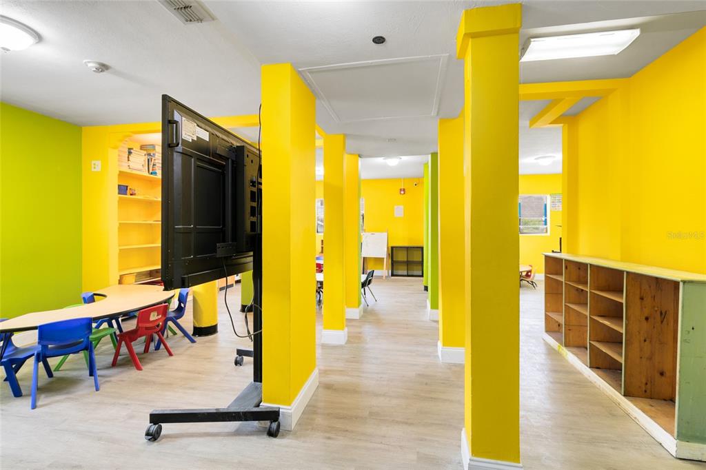 4607 North Pine Hills Road Orlando, FL 32808 - Photo 21 of 26 a view of a swimming pool with seating area