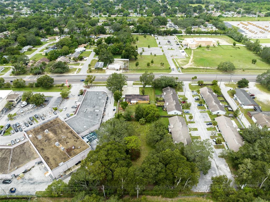 4607 North Pine Hills Road Orlando, FL 32808 - Photo 22 of 26 an aerial view of residential houses with outdoor space