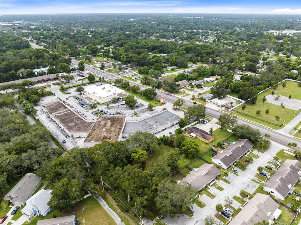 4607 North Pine Hills Road Orlando, FL 32808 - Photo 23 of 26 an aerial view of residential houses with outdoor space and trees