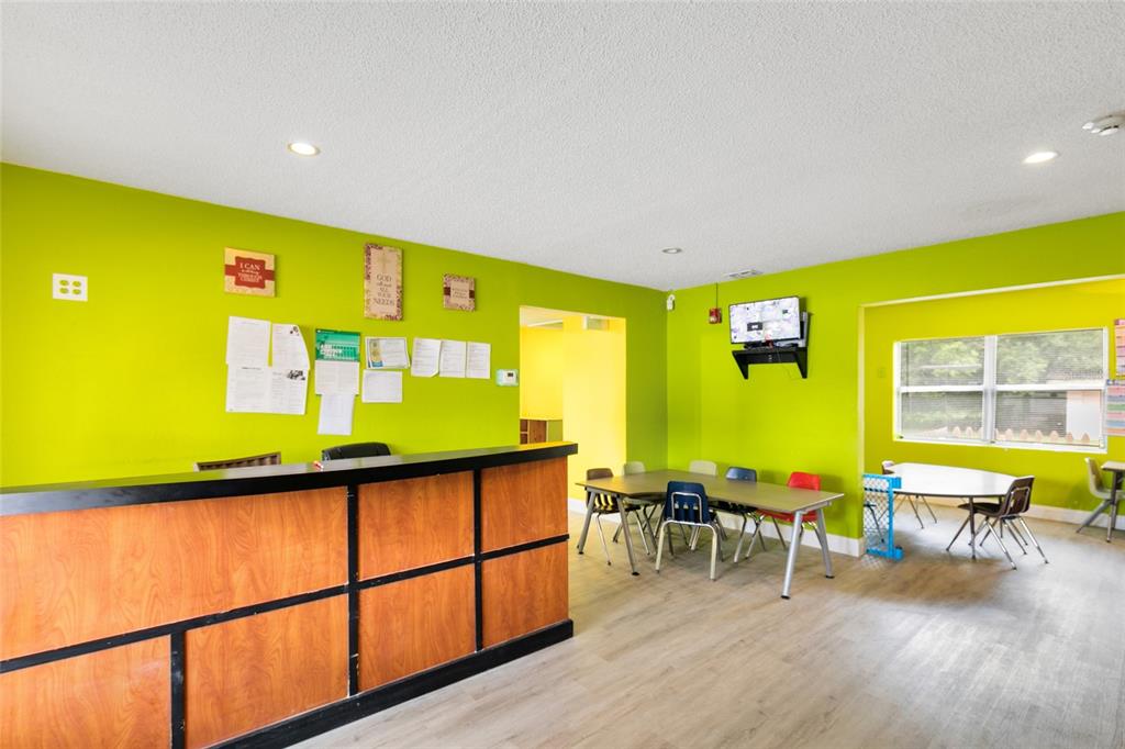 4607 North Pine Hills Road Orlando, FL 32808 - Photo 4 of 26 a view of a swimming pool with chairs