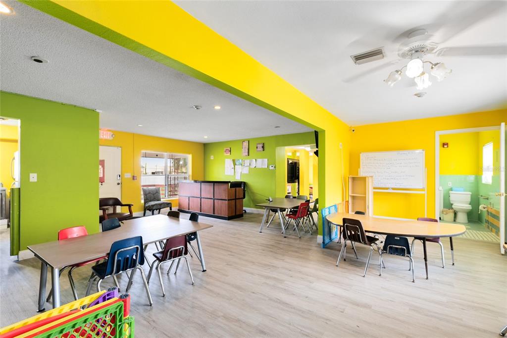4607 North Pine Hills Road Orlando, FL 32808 - Photo 7 of 26 a view of a dining room with furniture and chandelier