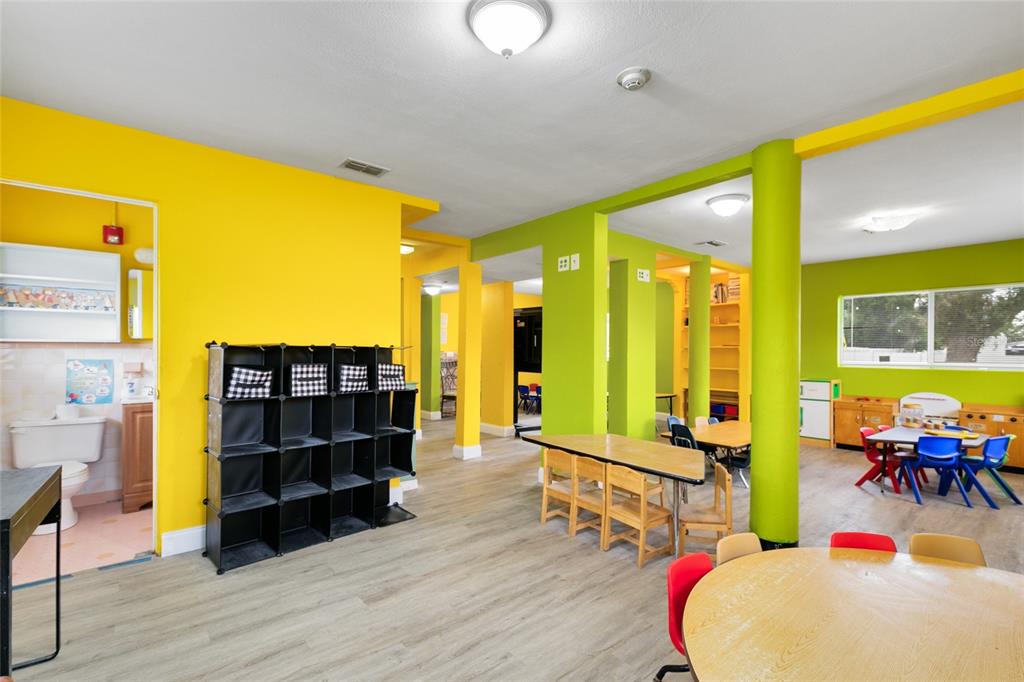 4607 North Pine Hills Road Orlando, FL 32808 - Photo 9 of 26 a living room with furniture and wooden floor