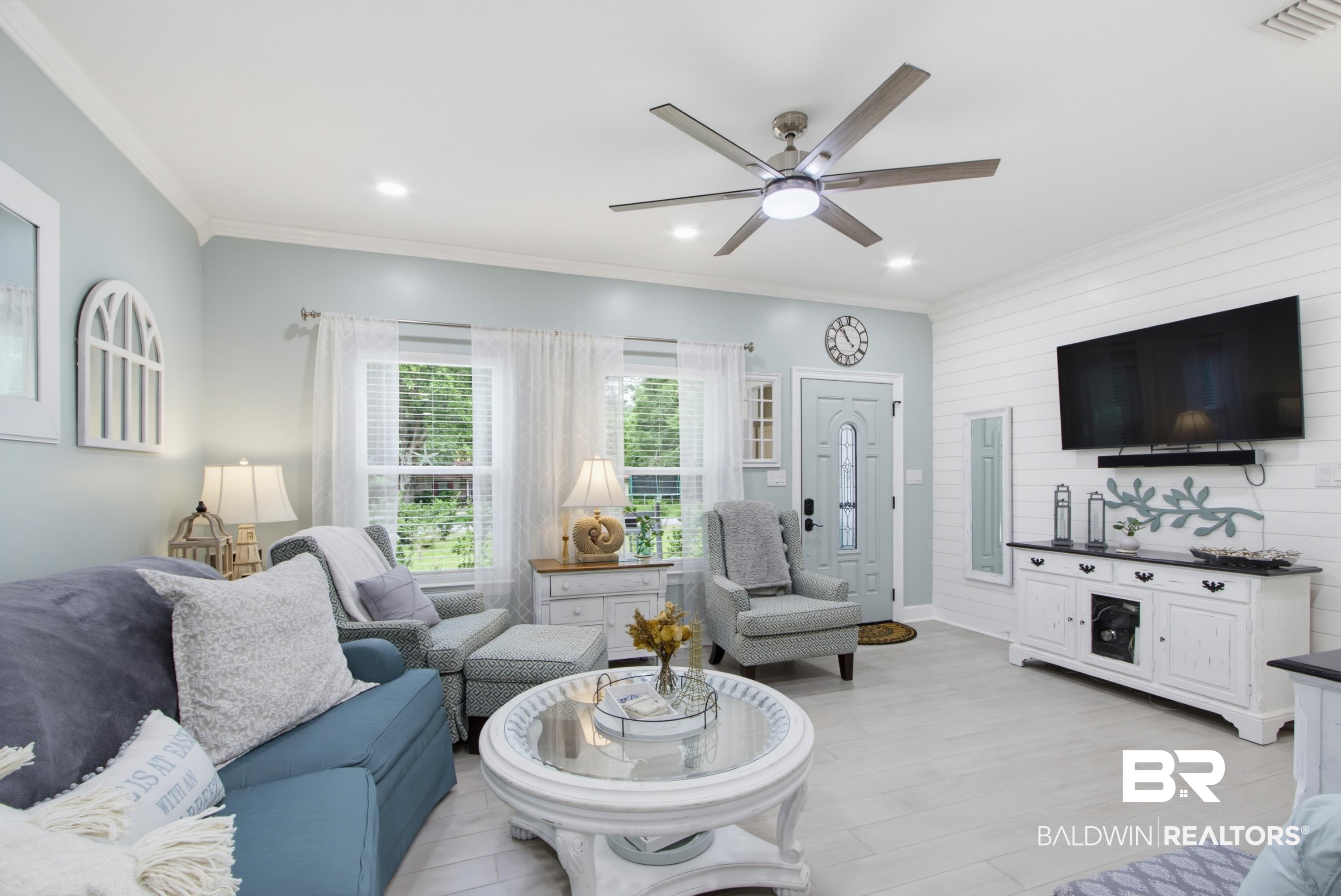 7472 Coopers Landing Road Foley, AL 36535 - Photo 3 of 40 Living area featuring sea salt walls, a white shiplap accent wall, recessed lighting, and a contemporary ceiling fan