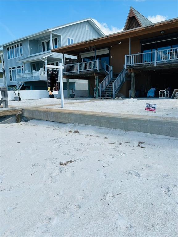 18218 Sunset Boulevard, Unit B St. Petersburg, FL 33708 - Photo 11 of 38 a view of building with an outdoor space