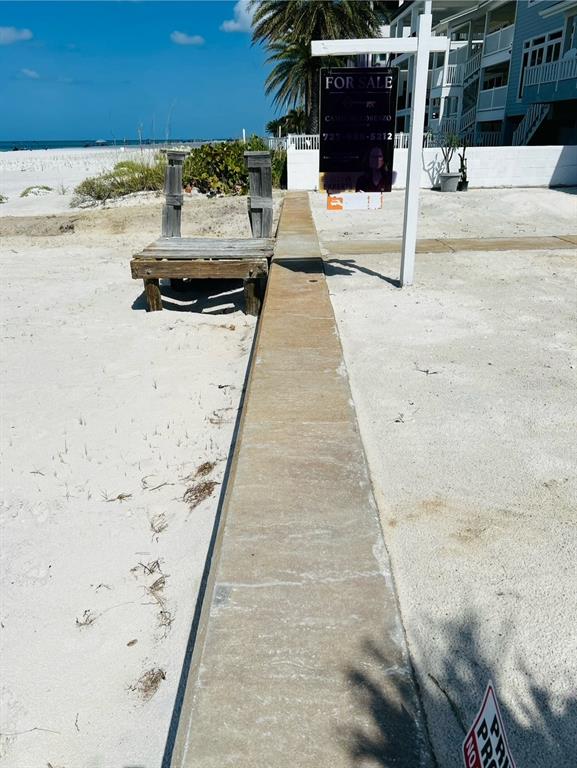 18218 Sunset Boulevard, Unit B St. Petersburg, FL 33708 - Photo 13 of 38 a view of a terrace with wooden floor
