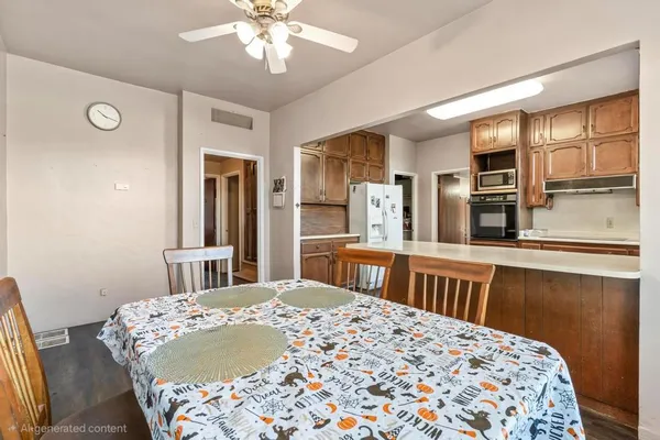 a kitchen with stainless steel appliances granite countertop wooden cabinets a sink and dishwasher a oven with wooden floors