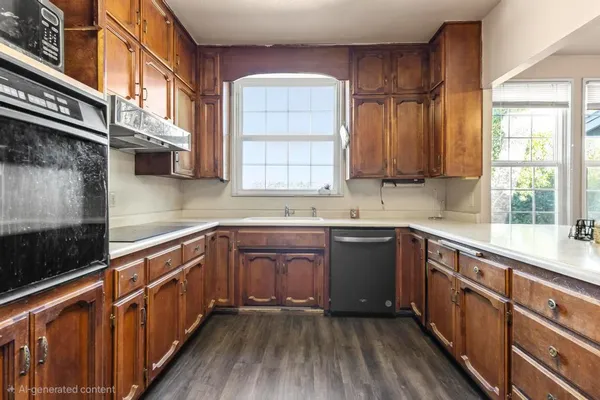 a kitchen with stainless steel appliances a refrigerator and a sink