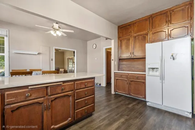 a kitchen with stainless steel appliances a refrigerator and cabinets