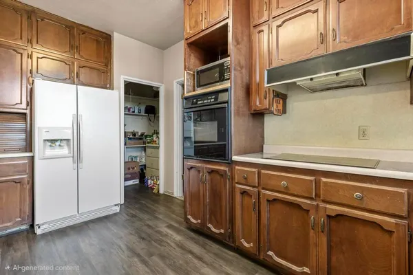 a view of walk in closet with wooden floor