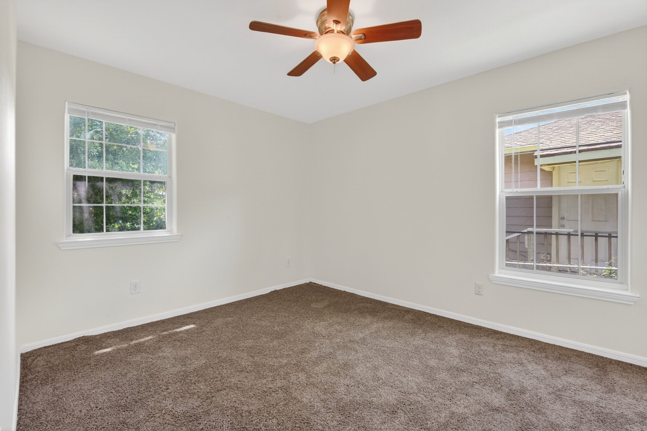 7013 St Augustine Street Houston, TX 77021 - Photo 24 of 35 an empty room with a window and a ceiling fan