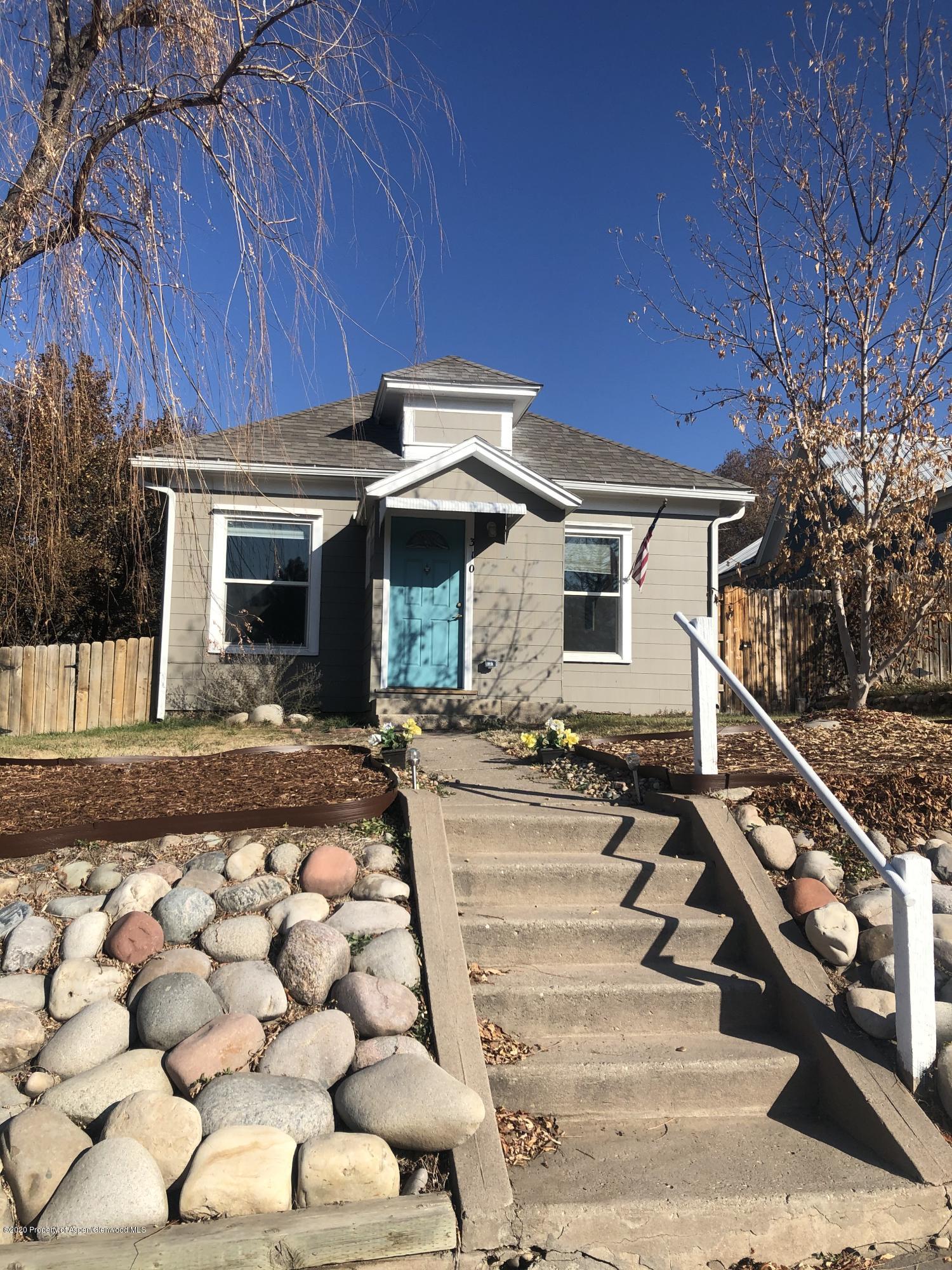 310 East 5th Street Rifle, CO 81650 - Photo 2 of 27 a front view of a house with garden