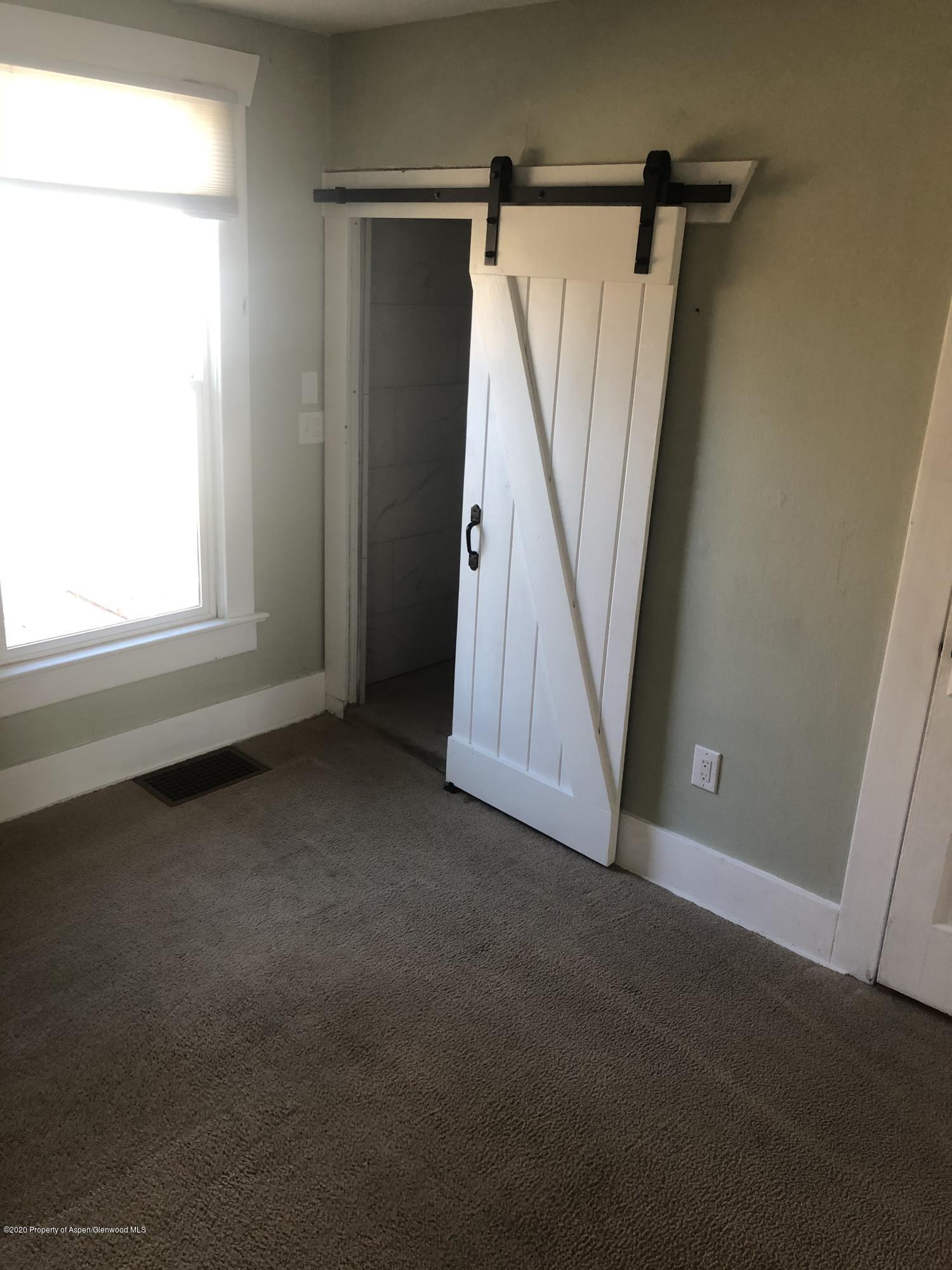 310 East 5th Street Rifle, CO 81650 - Photo 26 of 27 a view of an empty room with a window