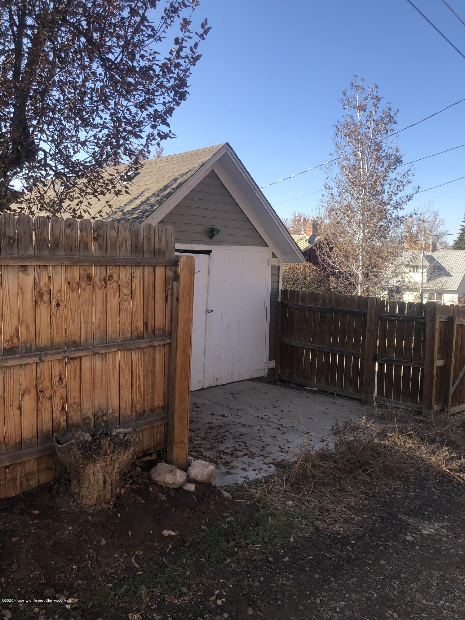 310 East 5th Street Rifle, CO 81650 - Photo 4 of 27 a front view of a house with a yard