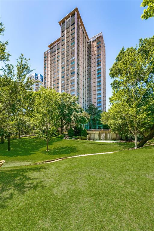 3525 Turtle Creek Boulevard, Unit 3C Dallas, TX 75219 - Photo 1 of 27 a front view of a building with a garden