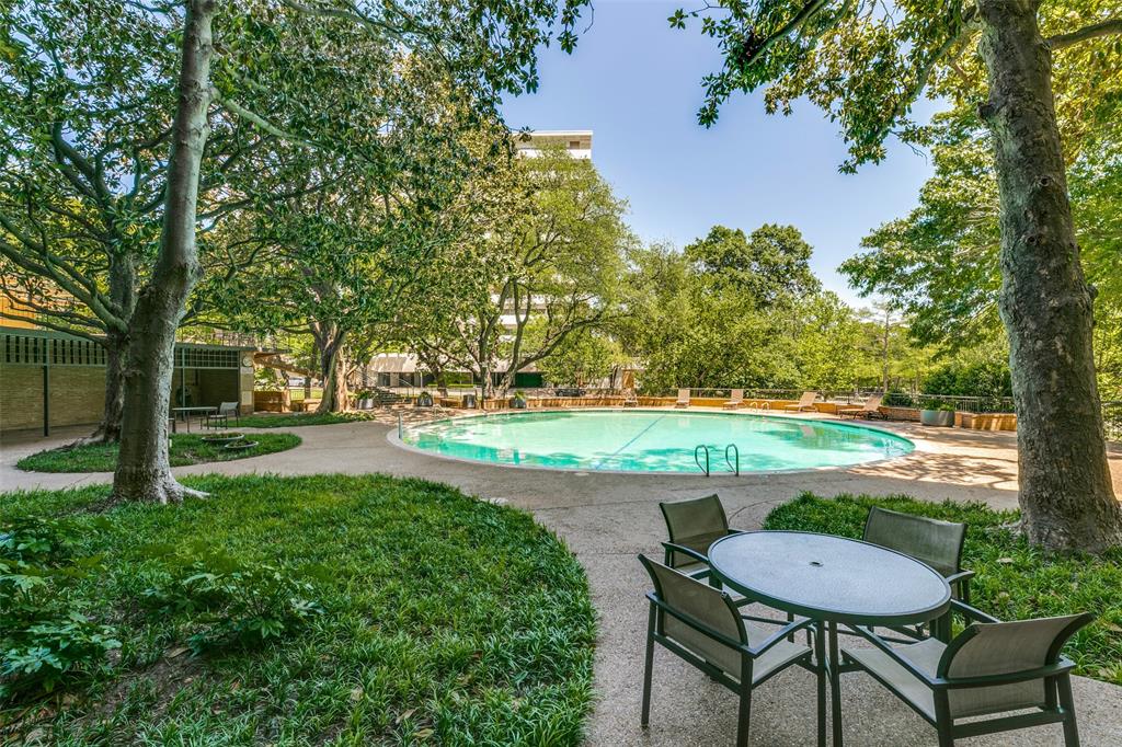 3525 Turtle Creek Boulevard, Unit 3C Dallas, TX 75219 - Photo 22 of 28 Pool with fence and a patio area