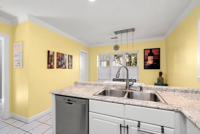 a kitchen with a sink and a refrigerator
