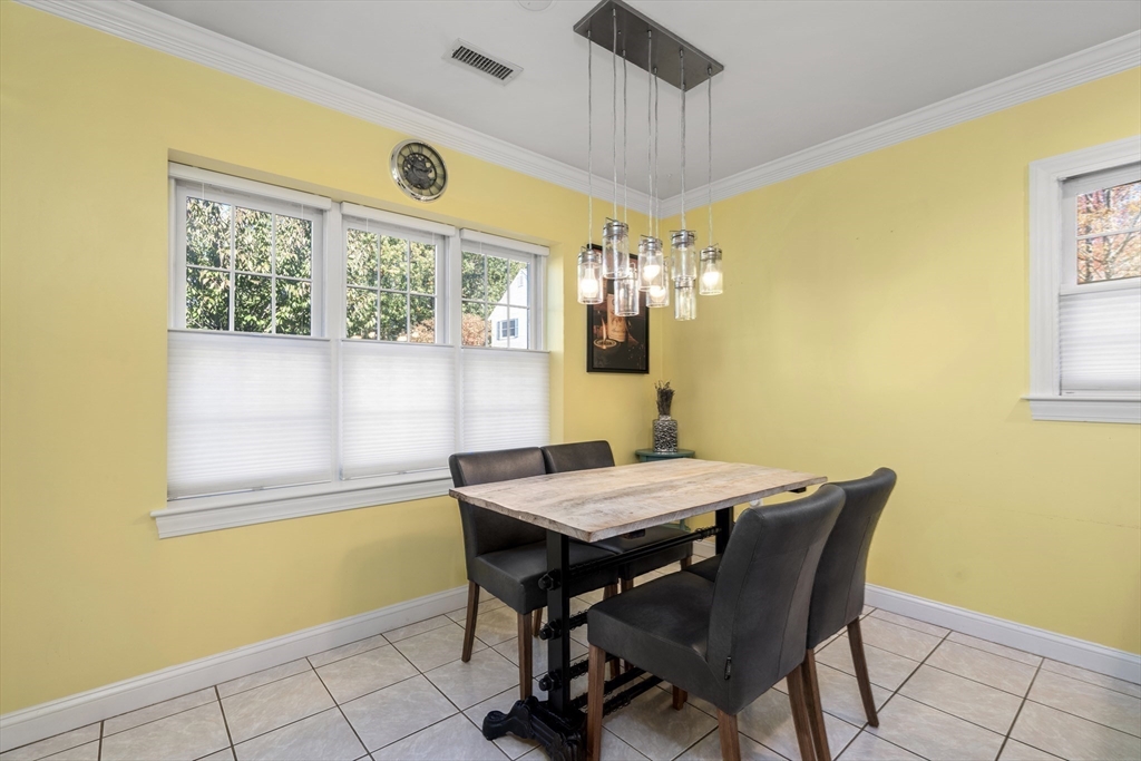 605 Middle Street, Unit 38 Braintree, MA 02184 - Photo 14 of 33 a view of a dining room with a table and chairs