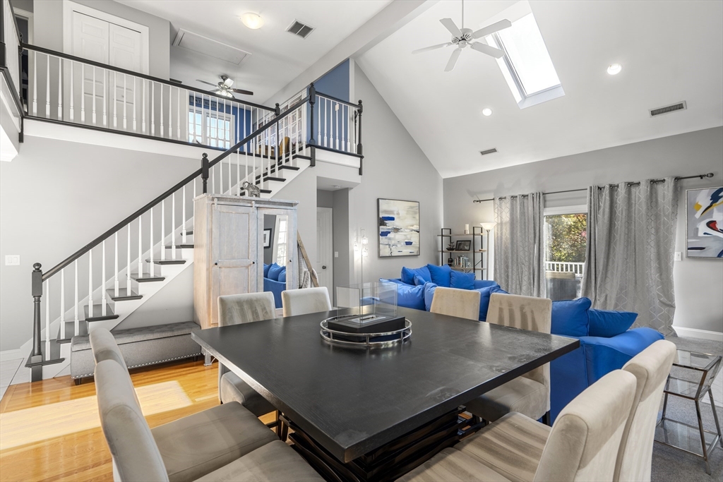 605 Middle Street, Unit 38 Braintree, MA 02184 - Photo 19 of 33 a view of a dining room with furniture a chandelier and wooden floor