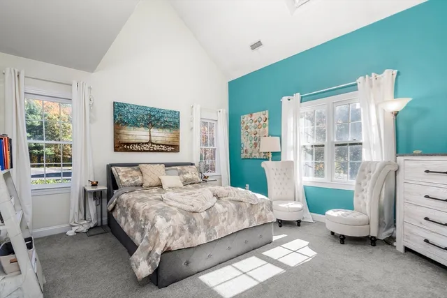 a bedroom with a bed and a couch