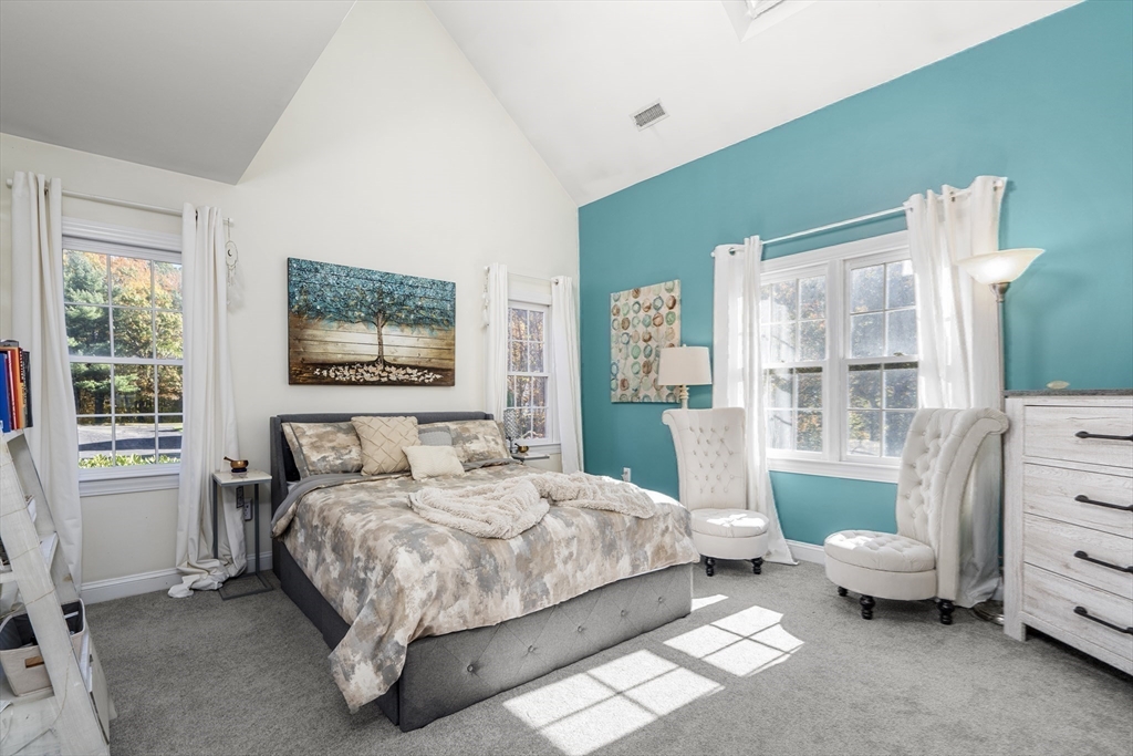 605 Middle Street, Unit 38 Braintree, MA 02184 - Photo 21 of 33 a bedroom with a bed and a couch