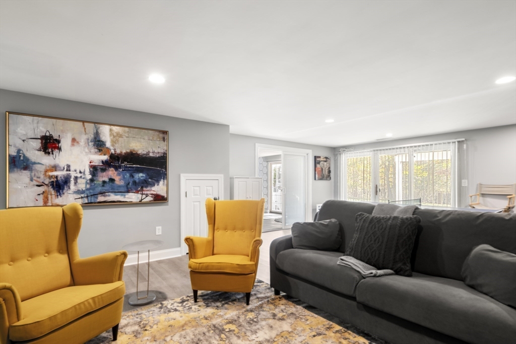 605 Middle Street, Unit 38 Braintree, MA 02184 - Photo 28 of 33 a living room with furniture and a large window
