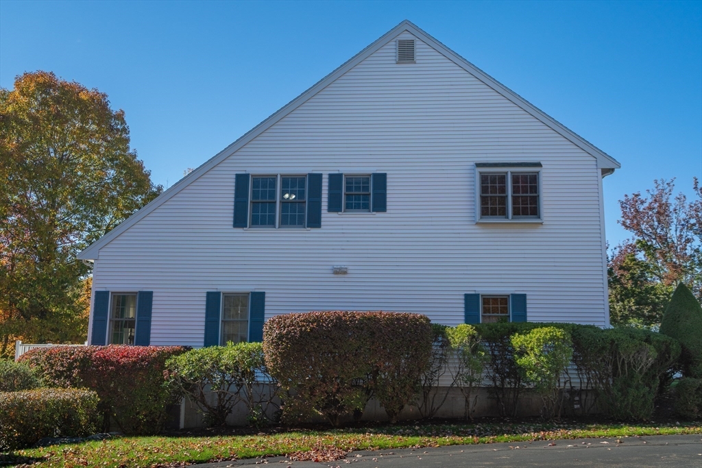 605 Middle Street, Unit 38 Braintree, MA 02184 - Photo 3 of 33 a front view of a house with a yard