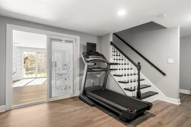 a view of an entryway with wooden floor