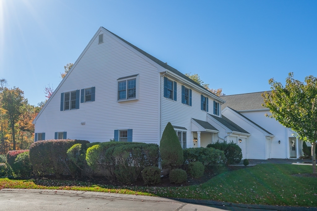 605 Middle Street, Unit 38 Braintree, MA 02184 - Photo 4 of 33 a front view of a house with a garden