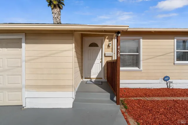a view of front door and a window