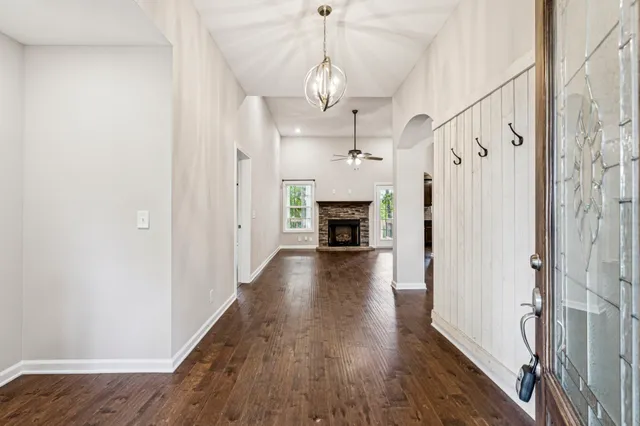 a view of main door and wooden floor