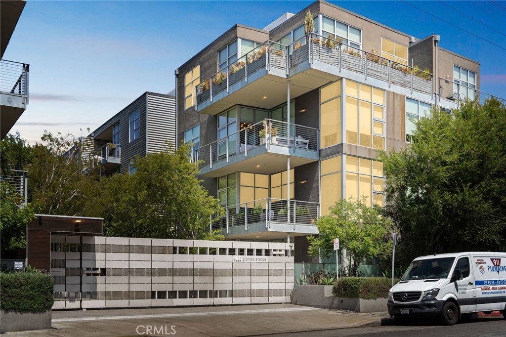 a view of a white building among the street side