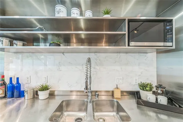 a view of a livingroom with furniture and a potted plant