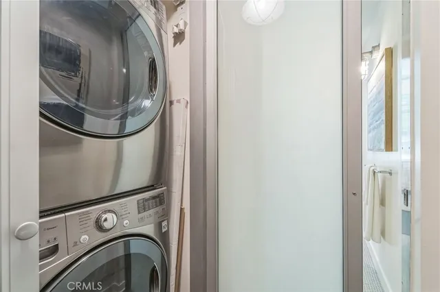 a view of a patio with couches table and chairs and potted plants