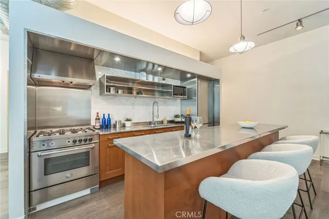 a kitchen with a stove a sink and a refrigerator