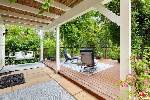 swimming pool view with a seating space
