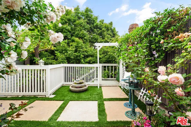 a front view of a house having fountain