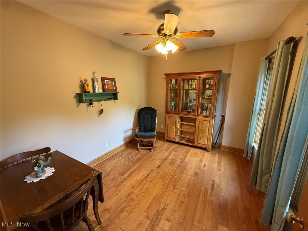 2178 Pleasant Valley Road Northeast New Philadelphia, OH 44663 - Photo 20 of 50 Sitting room featuring light wood-style floors and ceiling fan