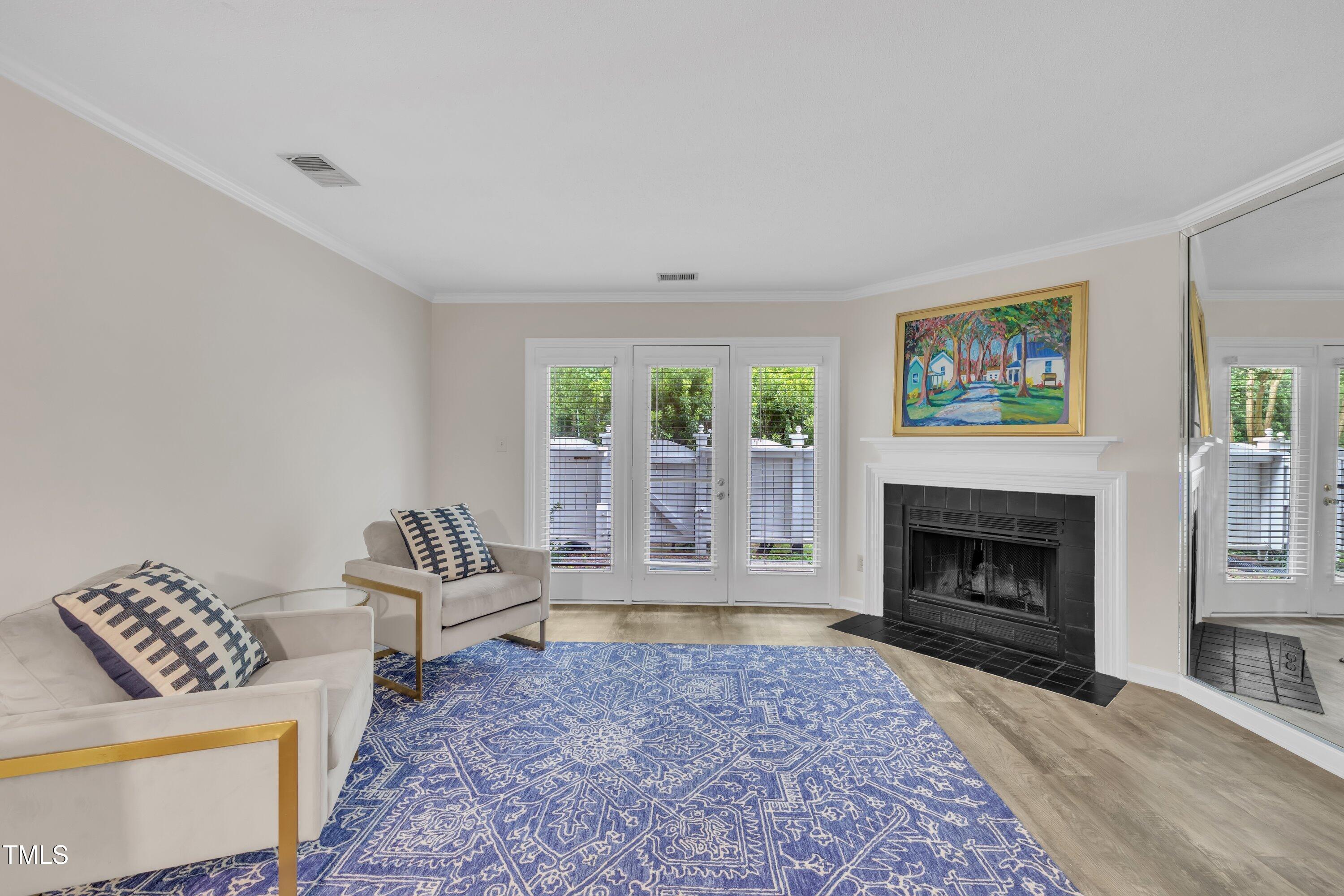 1442 Barton Pl Drive Raleigh, NC 27608 - Photo 4 of 16 a living room with furniture and a fireplace