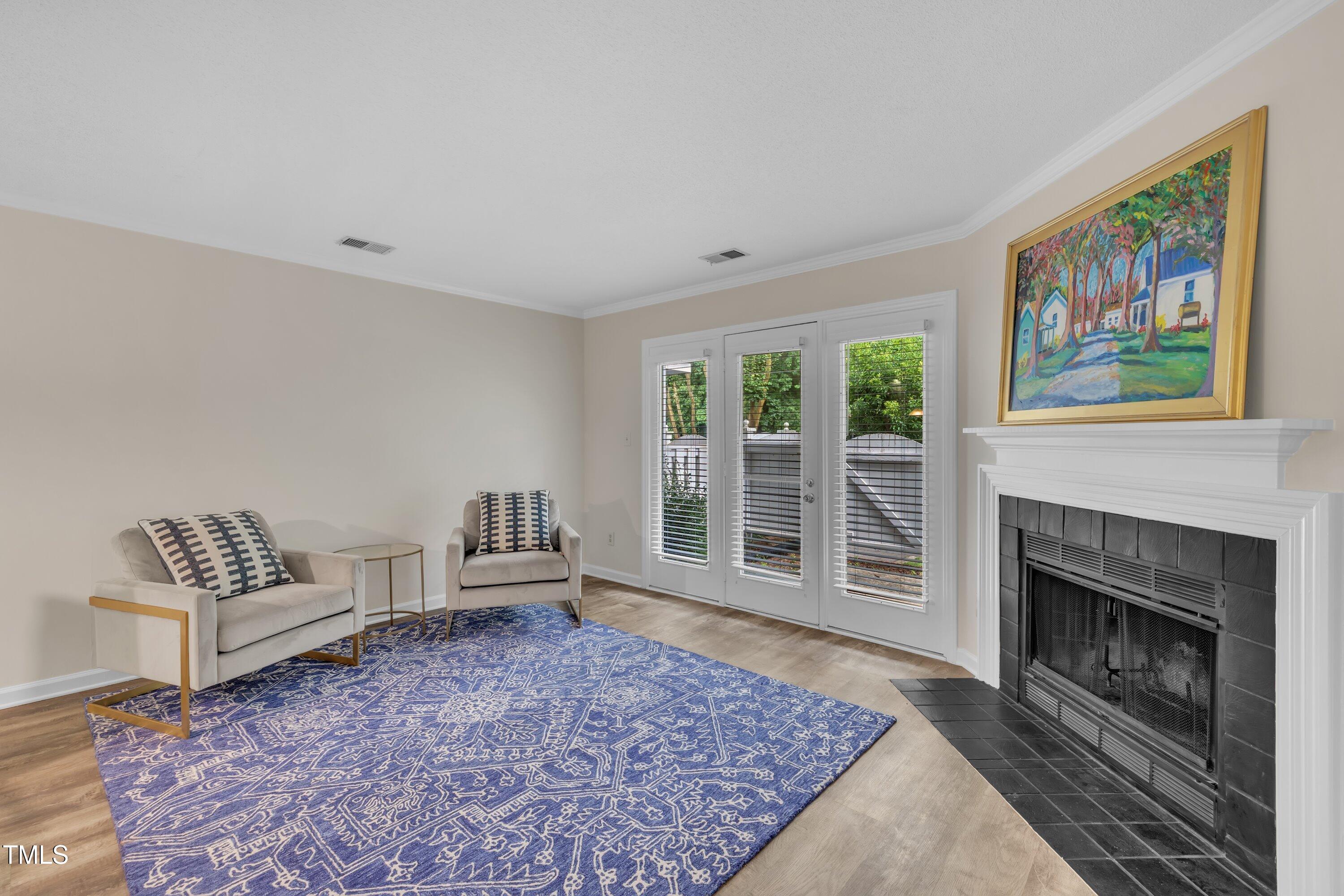 1442 Barton Pl Drive Raleigh, NC 27608 - Photo 5 of 16 a living room with furniture and a fireplace