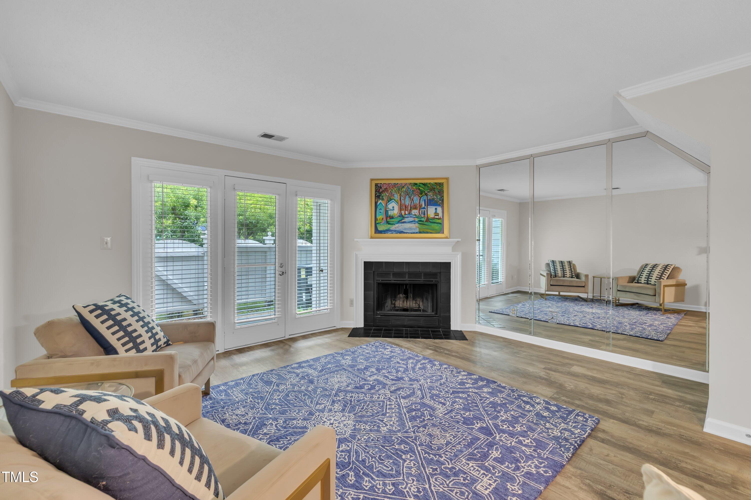 1442 Barton Pl Drive Raleigh, NC 27608 - Photo 7 of 16 a living room with furniture and a fireplace