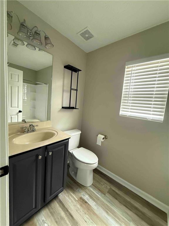 503 Sautee Place Canton, GA 30114 - Photo 11 of 17 a bathroom with a toilet sink and mirror