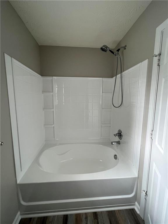 503 Sautee Place Canton, GA 30114 - Photo 12 of 17 a bathroom with a bathtub and a shower