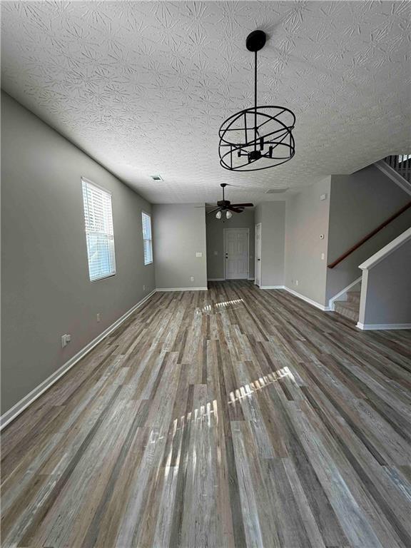 503 Sautee Place Canton, GA 30114 - Photo 2 of 17 a view of empty room with wooden floor and window
