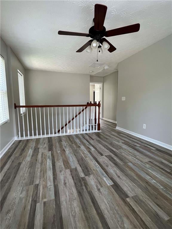 503 Sautee Place Canton, GA 30114 - Photo 8 of 17 a view of staircase with wooden floor and window